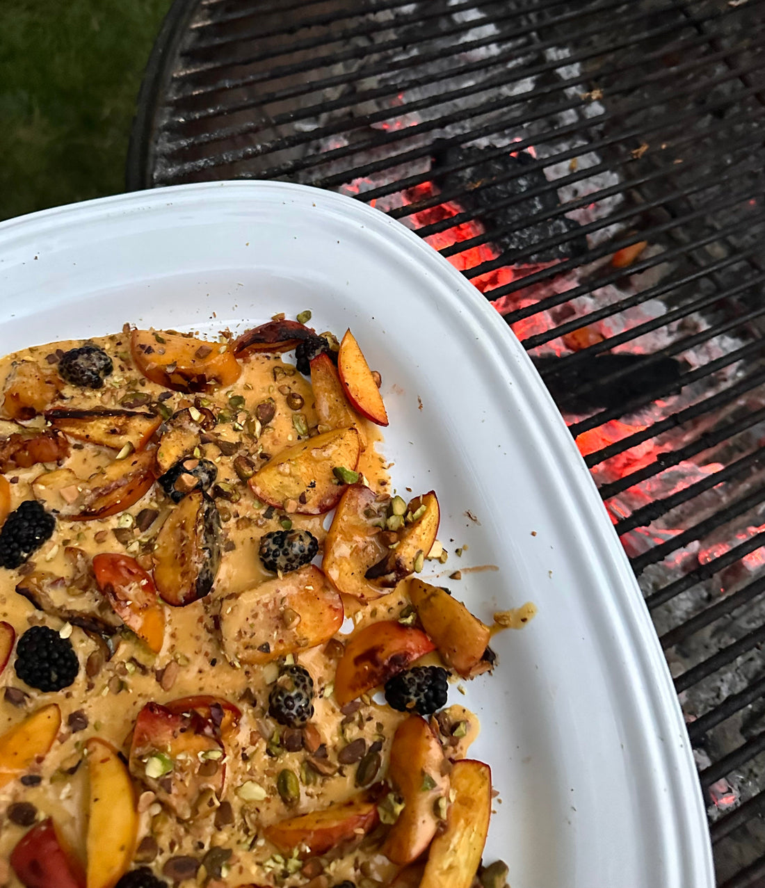 Grilled Peaches in Harissa Sabayon with Berries and Pistachios