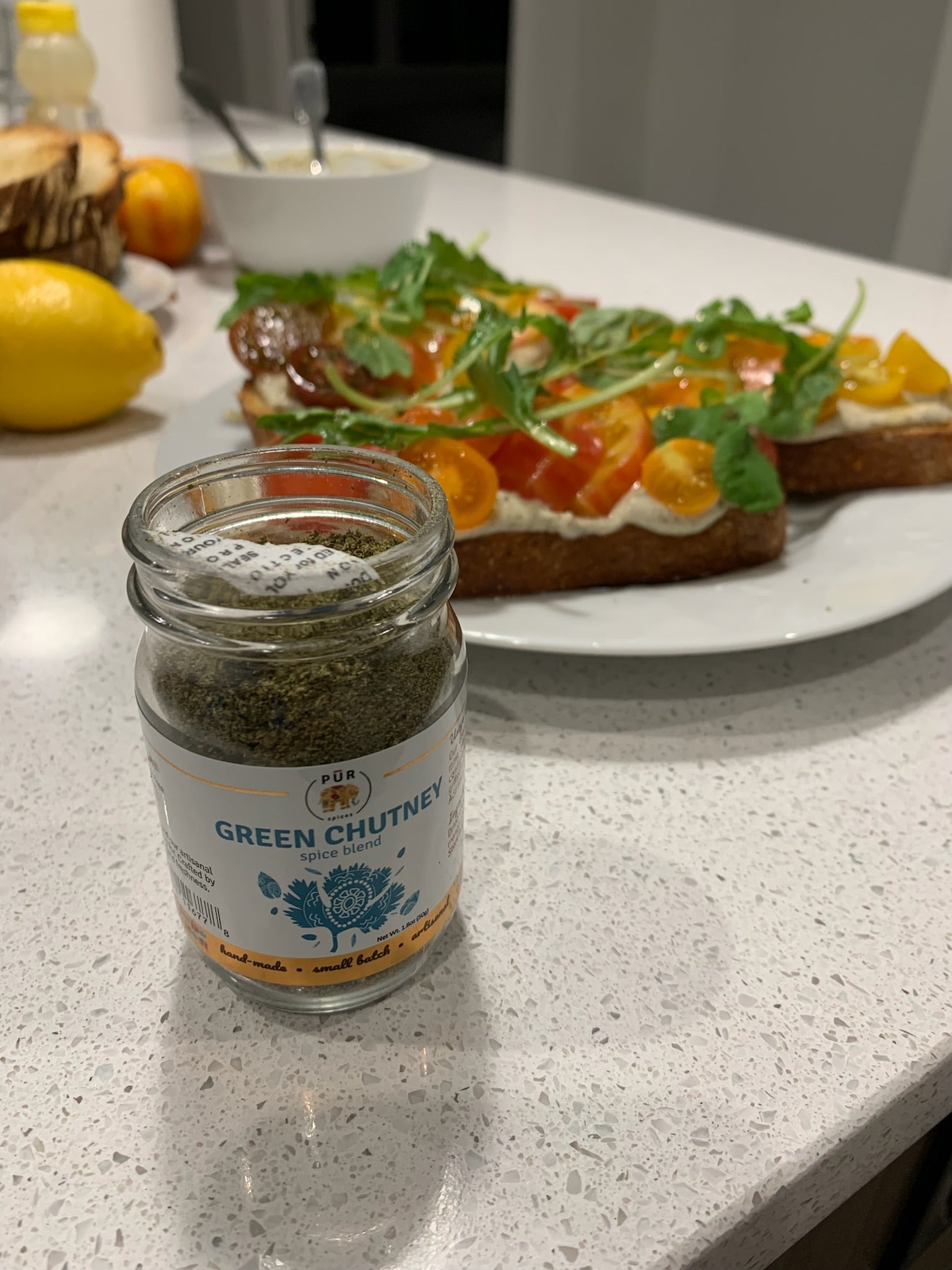 Summer Tomato and Garlic Toast with Green Chutney Tahini and Arugula Salad
